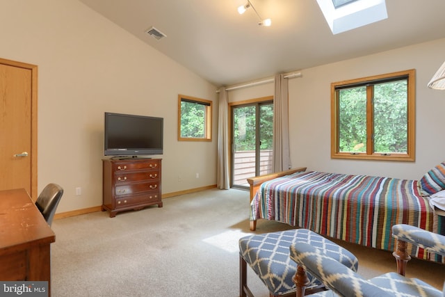 1023 Fairdell Dr, Hummelstown, PA 17036 - bedroom featuring vaulted ceiling, access to exterior, light carpet, a skylight, and baseboards