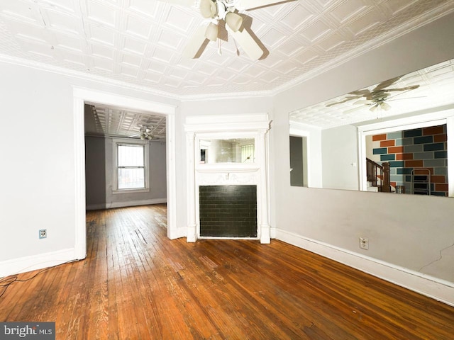unfurnished living room with a fireplace, baseboards, and a ceiling fan