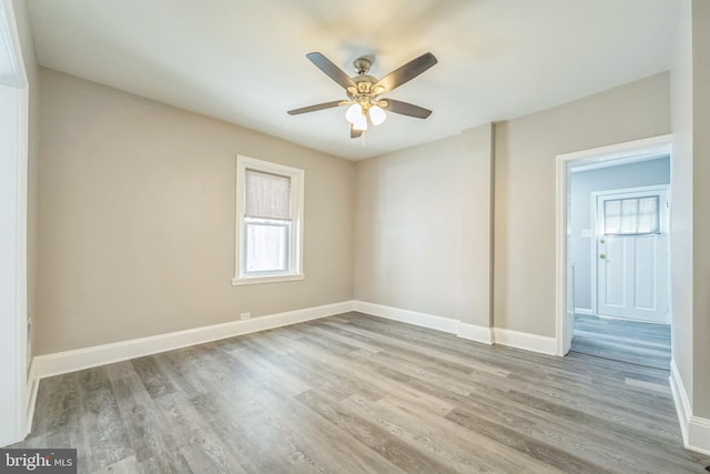 2325 W 4th St, Chester, PA 19013 - spare room with baseboards, ceiling fan, a healthy amount of sunlight, and wood finished floors