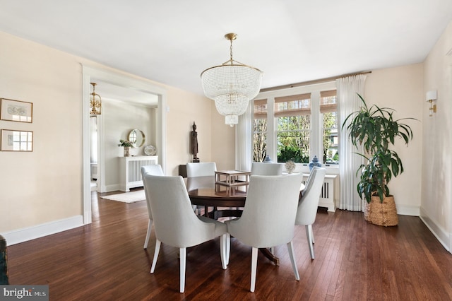 3712 Bradley Ln, Chevy Chase, MD 20815 - dining area featuring a chandelier, dark wood-type flooring, and baseboards