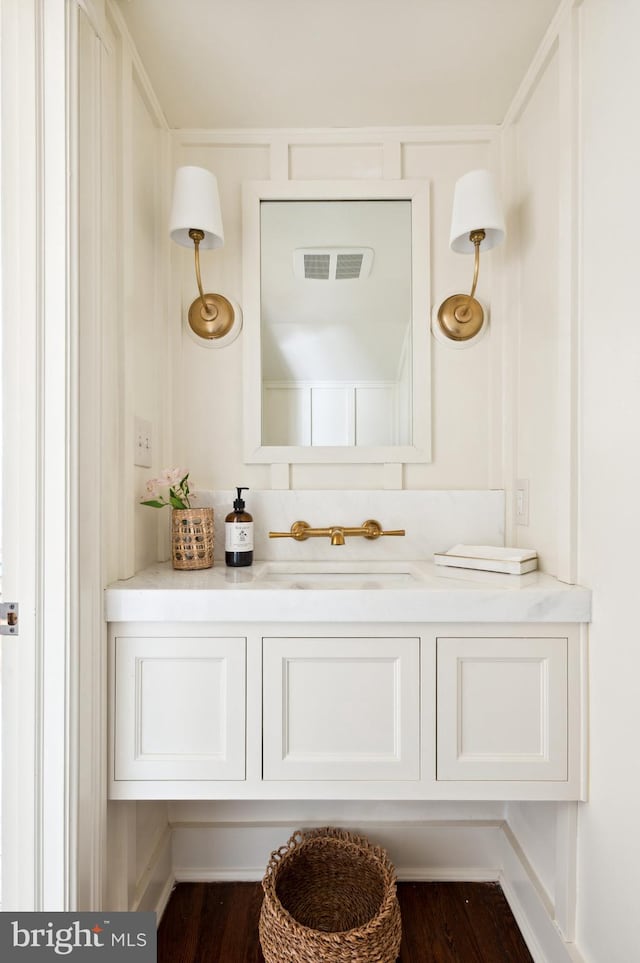 3712 Bradley Ln, Chevy Chase, MD 20815 - bathroom featuring vanity and wood finished floors