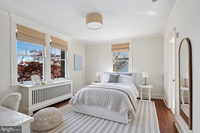 3712 Bradley Ln, Chevy Chase, MD 20815 - bedroom featuring radiator heating unit, wood finished floors, baseboards, and crown molding