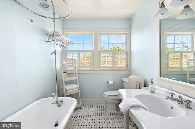 3712 Bradley Ln, Chevy Chase, MD 20815 - full bathroom featuring a freestanding bath, toilet, baseboards, and a sink
