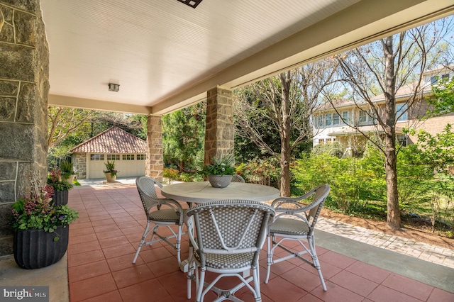 3712 Bradley Ln, Chevy Chase, MD 20815 - view of patio with outdoor dining area and an outbuilding