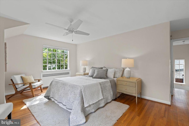 3721 Massachusetts Ave NW, Washington, DC 20016 - bedroom with radiator, wood finished floors, baseboards, and a ceiling fan