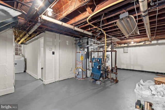 3721 Massachusetts Ave NW, Washington, DC 20016 - unfinished below grade area with gas water heater, baseboards, a heating unit, and washer / clothes dryer