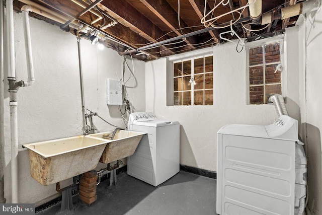 3721 Massachusetts Ave NW, Washington, DC 20016 - laundry room featuring separate washer and dryer and baseboards