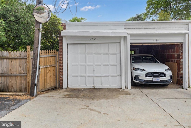 3721 Massachusetts Ave NW, Washington, DC 20016 - garage with fence and concrete driveway