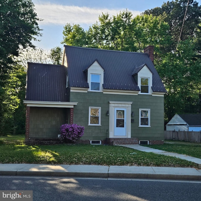 710 Roger St, Salisbury, MD 21804 - cape cod-style house with entry steps, a chimney, and a metal roof