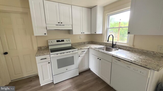 710 Roger St, Salisbury, MD 21804 - kitchen with white appliances, under cabinet range hood, dark wood-style flooring, and white cabinetry
