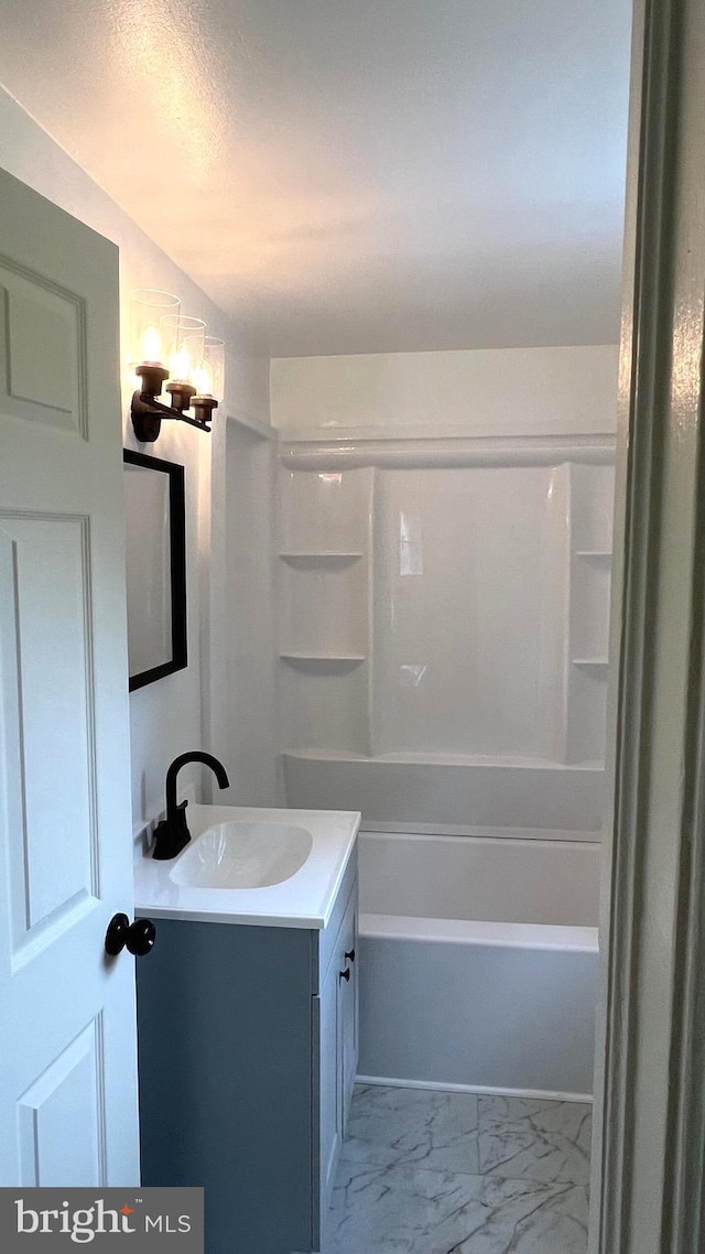 710 Roger St, Salisbury, MD 21804 - bathroom featuring vanity, marble finish flooring, shower / tub combination, and a chandelier