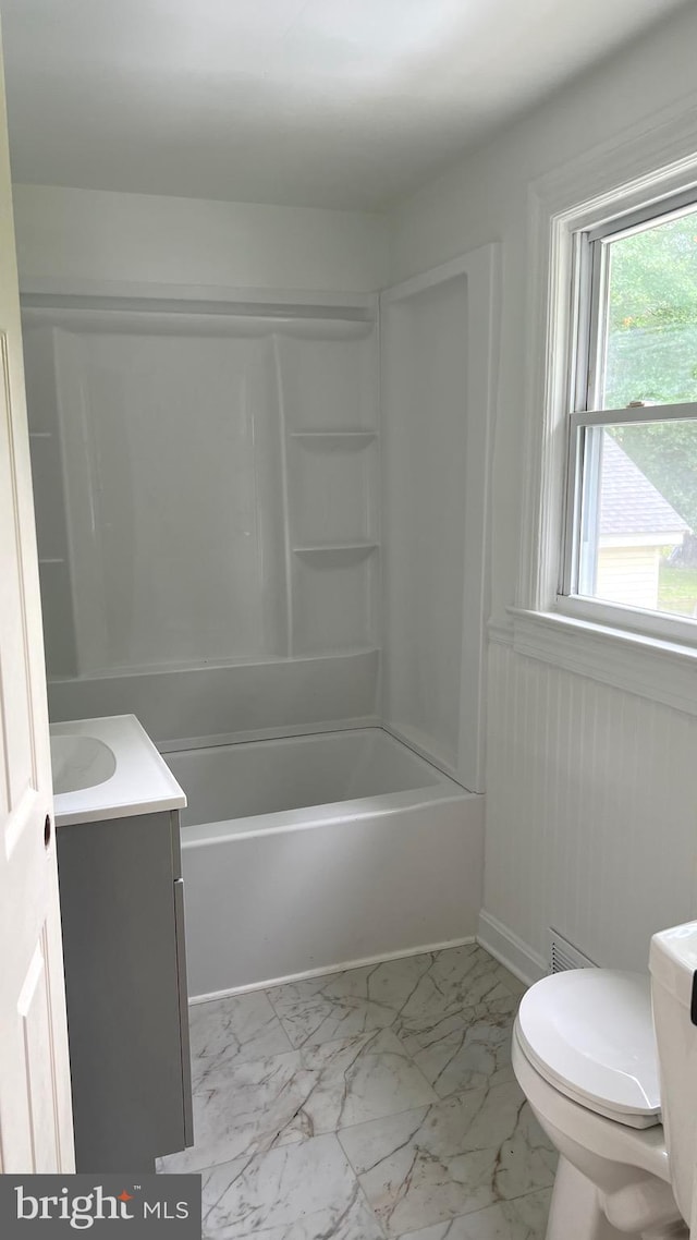 710 Roger St, Salisbury, MD 21804 - bathroom featuring vanity, marble look tiles, and shower / washtub combination