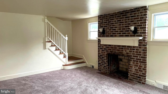710 Roger St, Salisbury, MD 21804 - unfurnished living room featuring stairs, carpet floors, and a fireplace