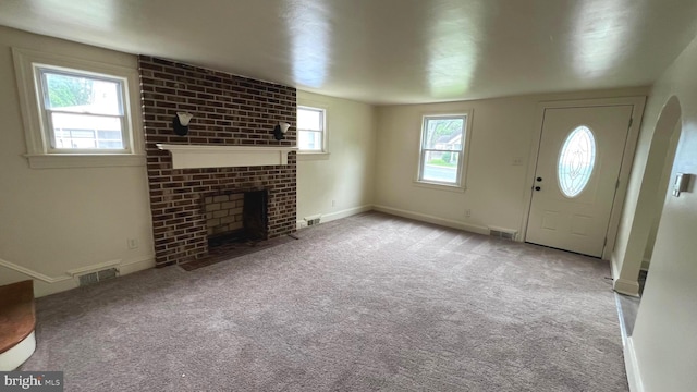 710 Roger St, Salisbury, MD 21804 - entrance foyer with a brick fireplace and carpet floors