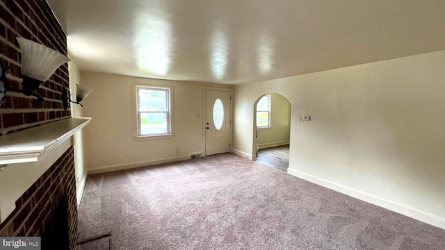 710 Roger St, Salisbury, MD 21804 - foyer featuring arched walkways and carpet flooring