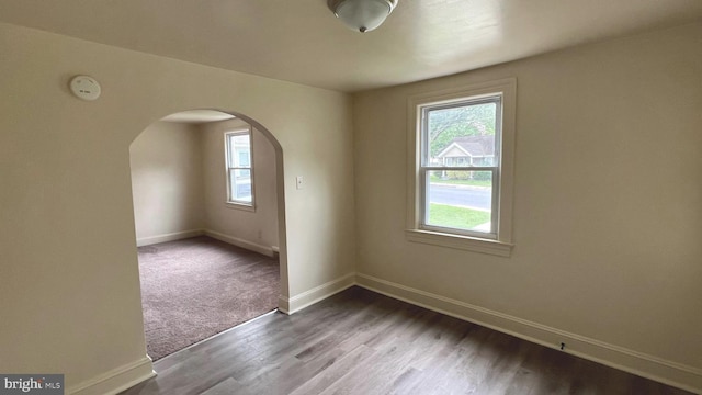 710 Roger St, Salisbury, MD 21804 - unfurnished room with arched walkways, wood finished floors, and a smoke detector