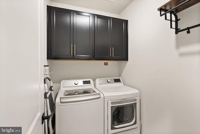 laundry room with cabinet space and washing machine and dryer