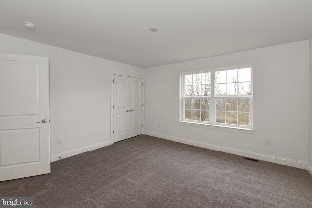 400 Rederick Ln Unit 2Oxford, Middletown, DE 19709 - spare room featuring dark colored carpet, baseboards, and a smoke detector