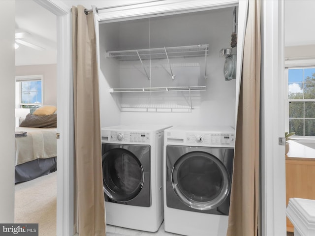 1909 Kenwood Ave Unit 303, Alexandria, VA 22302 - laundry room featuring independent washer and dryer, laundry area, a ceiling fan, and a wealth of natural light
