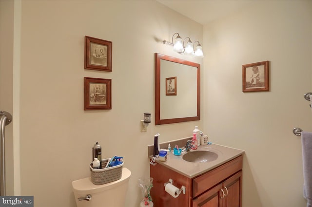bathroom with toilet and vanity