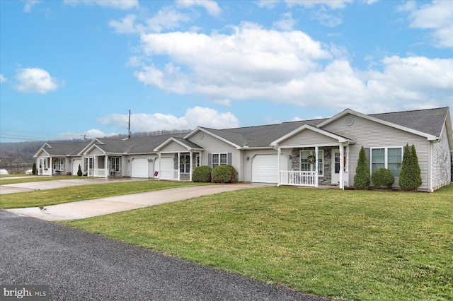 single story home featuring a porch, a front lawn, a garage, and concrete driveway