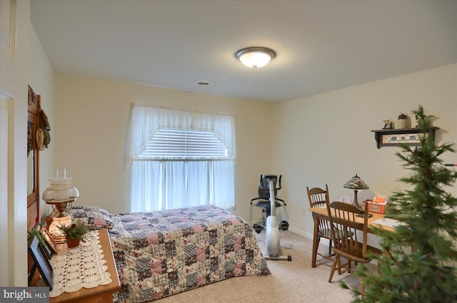 carpeted bedroom with baseboards