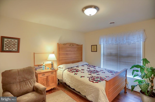 bedroom with wood finished floors
