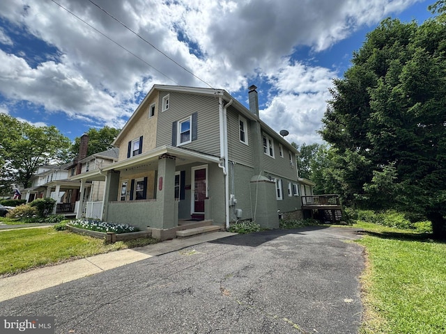 314 W Glenside Ave, Glenside, PA 19038 - view of front of property with a chimney, a front yard, and covered porch