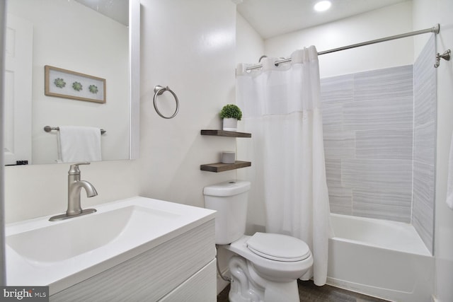 full bathroom with shower / bath combination with curtain, vanity, and toilet