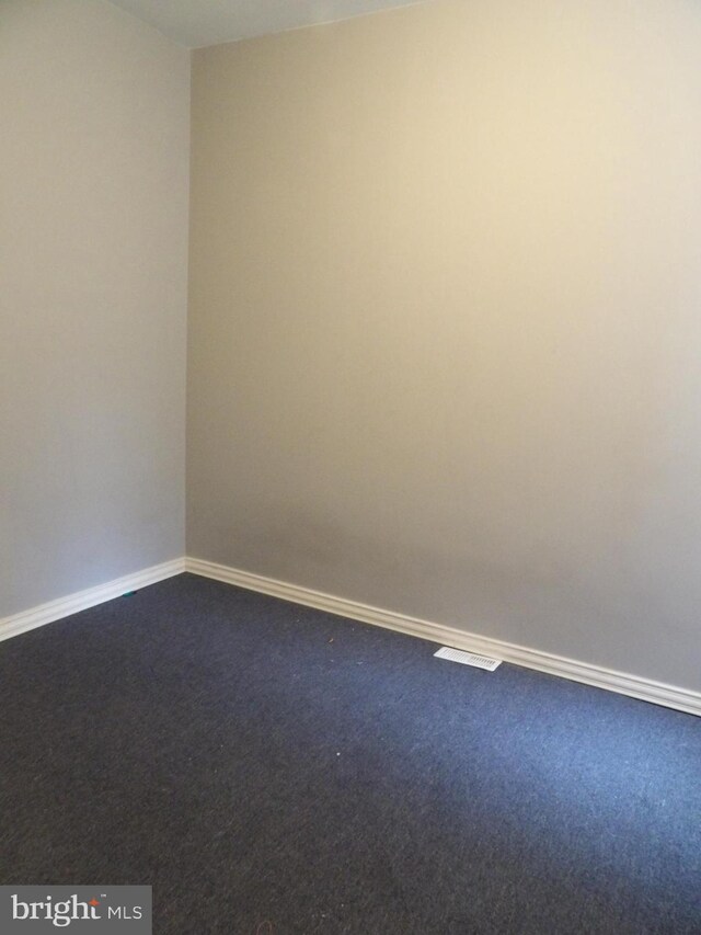 2321 W Lehigh Ave, Philadelphia, PA 19132 - empty room featuring dark carpet and baseboards