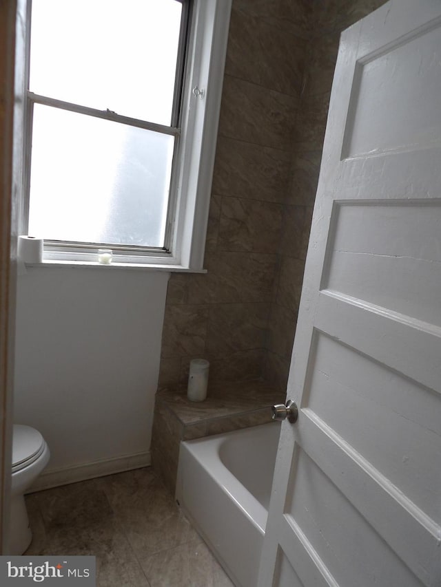2321 W Lehigh Ave, Philadelphia, PA 19132 - bathroom featuring toilet, a tub, and tile patterned floors