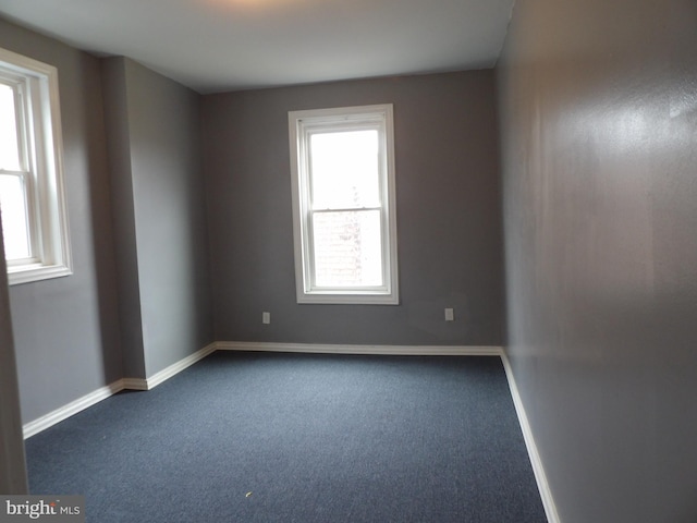 2321 W Lehigh Ave, Philadelphia, PA 19132 - empty room with dark colored carpet and baseboards