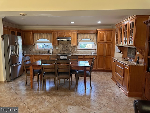 807 New Dover Rd, Edison, NJ 08820 - kitchen with light stone countertops, a sink, brown cabinetry, under cabinet range hood, and stainless steel refrigerator with ice dispenser