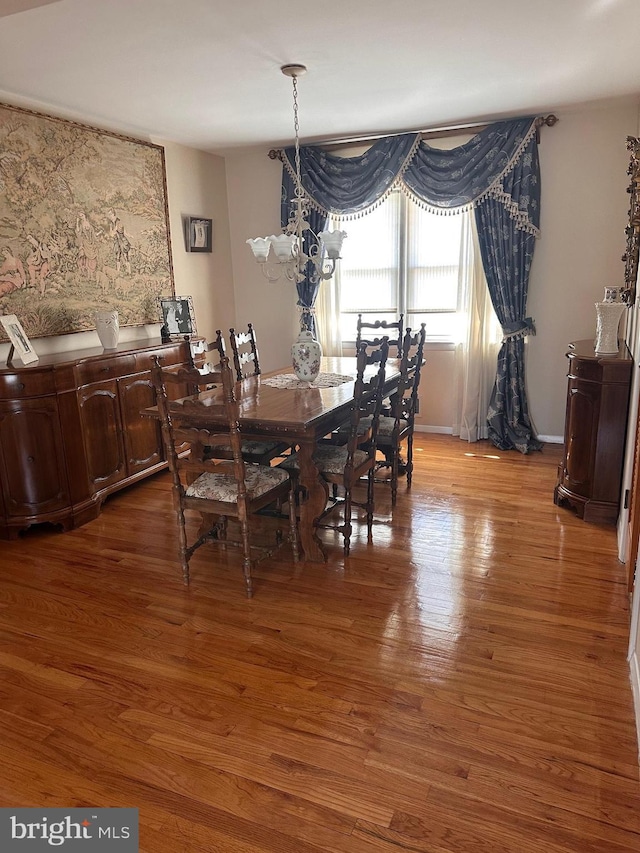 807 New Dover Rd, Edison, NJ 08820 - dining room with light wood finished floors and a chandelier