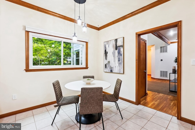 6364 Evangeline Ln, Alexandria, VA 22312 - dining area with crown molding, light tile patterned floors, and baseboards