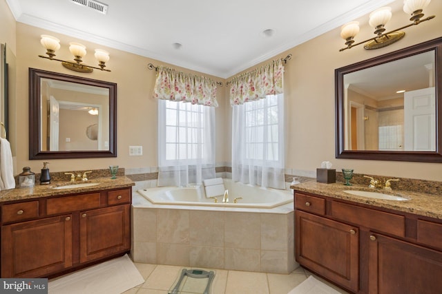 full bathroom featuring visible vents, tile patterned flooring, a garden tub, and a sink