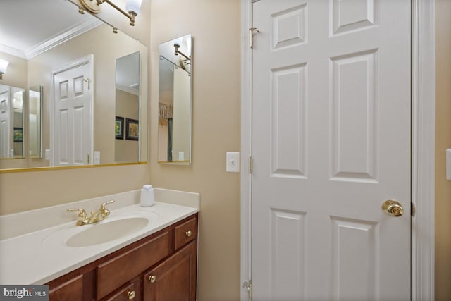 bathroom featuring vanity and ornamental molding