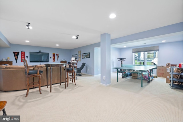 interior space with baseboards, recessed lighting, and carpet