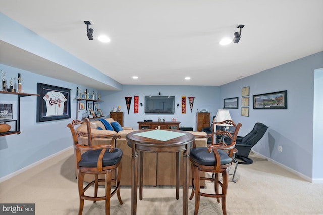 bar featuring recessed lighting, a bar, baseboards, and light carpet