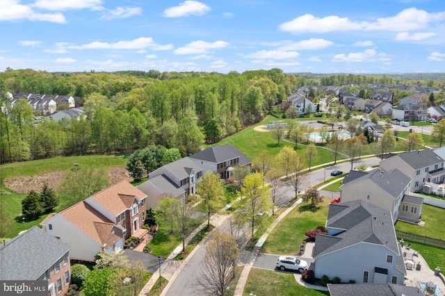 birds eye view of property with a residential view