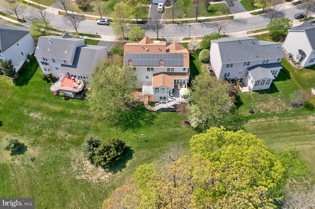 birds eye view of property with a residential view