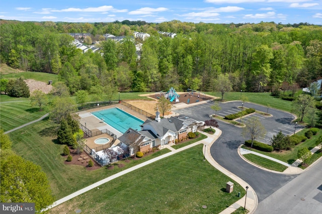 bird's eye view featuring a wooded view