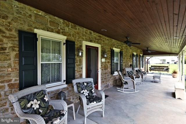 view of patio featuring ceiling fan