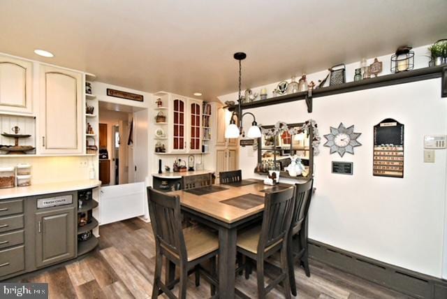 dining space with recessed lighting and dark wood-style flooring