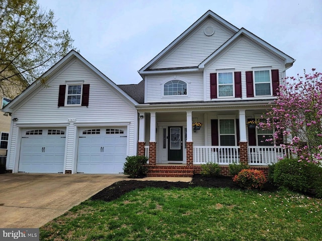 41430 Whimsical Ct, Leonardtown, MD 20650 - view of front of house with brick siding, a front lawn, driveway, and a porch