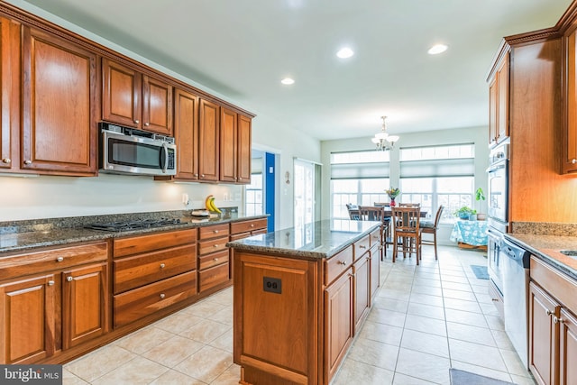 41430 Whimsical Ct, Leonardtown, MD 20650 - kitchen with stainless steel appliances, a center island, dark stone countertops, recessed lighting, and brown cabinetry