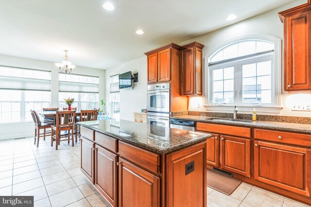 41430 Whimsical Ct, Leonardtown, MD 20650 - kitchen featuring recessed lighting, an inviting chandelier, light tile patterned floors, a sink, and appliances with stainless steel finishes