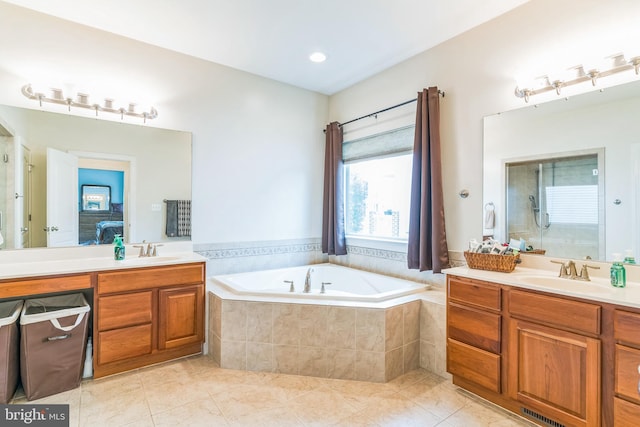 41430 Whimsical Ct, Leonardtown, MD 20650 - ensuite bathroom featuring a bath, two vanities, tile patterned floors, and a sink