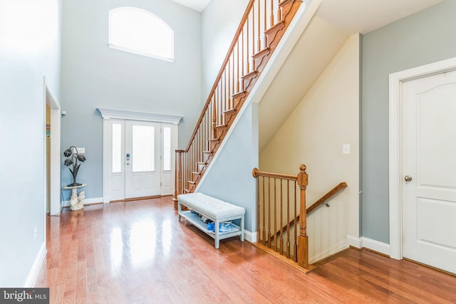 41430 Whimsical Ct, Leonardtown, MD 20650 - foyer featuring wood finished floors, a high ceiling, baseboards, and stairs