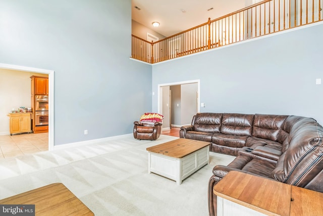 41430 Whimsical Ct, Leonardtown, MD 20650 - living room with baseboards, a towering ceiling, and light colored carpet